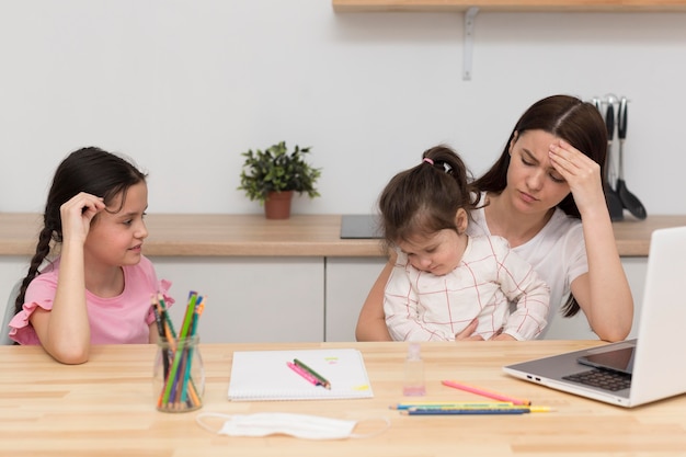 Mother having headache at table