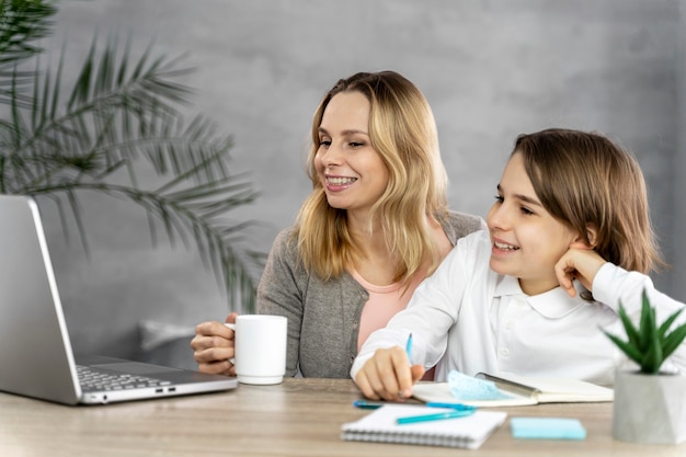 Mother helping daughter to study