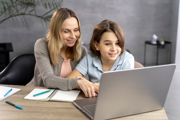 Mother helping daughter to study