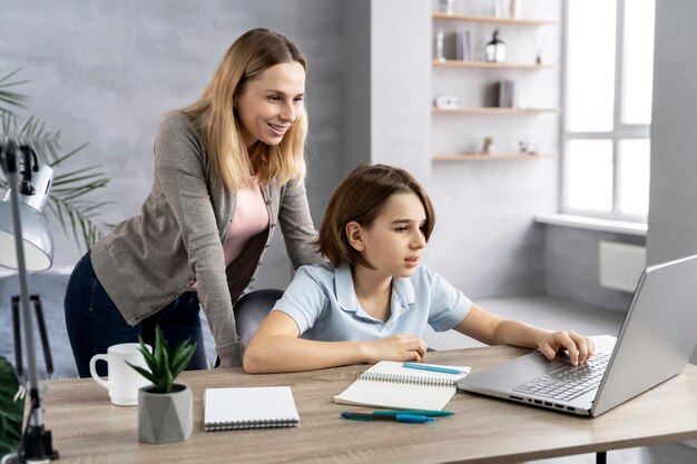 Mother helping daughter to study