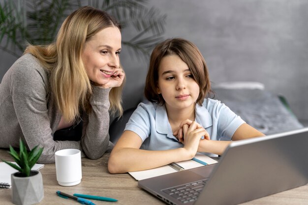 Mother helping daughter to study