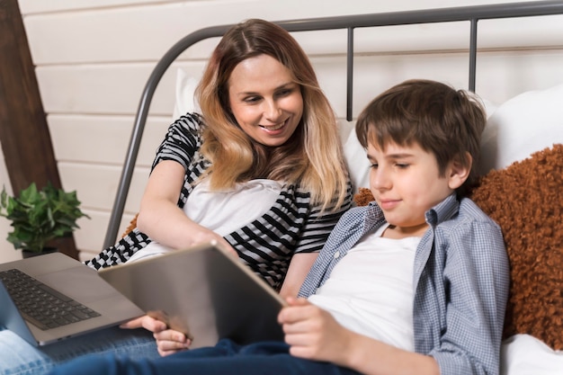 Mother helping son with homework