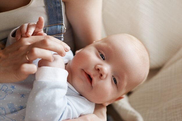 Mother and her child posing indoor