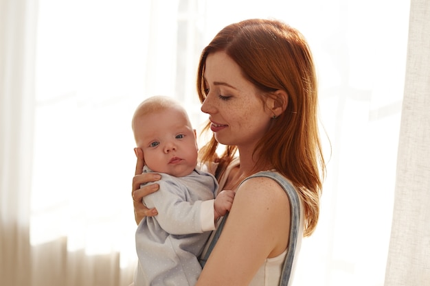 Mother and her child posing indoor