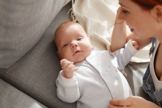 Mother and her child posing indoor