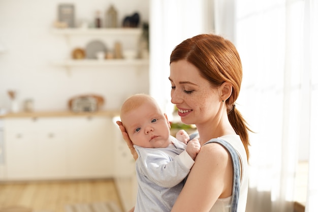 Mother and her child posing indoor