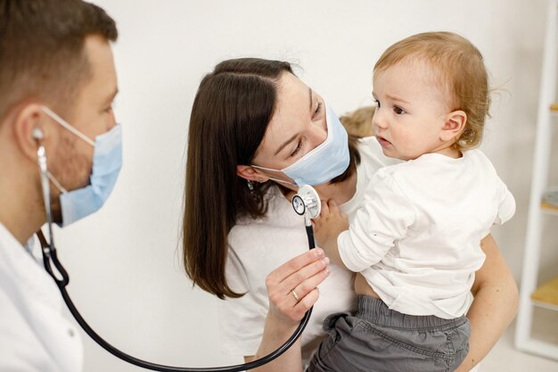 Mother and her son have an appointment with pediatrician