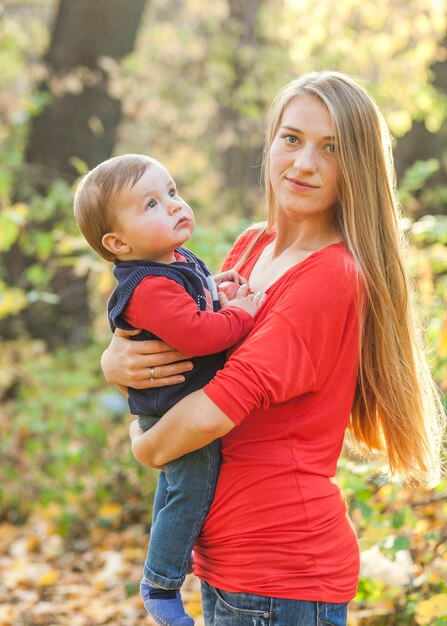 Mother holding cute baby boy