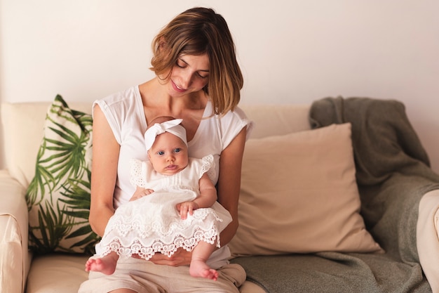 Mother holding newborn baby girl