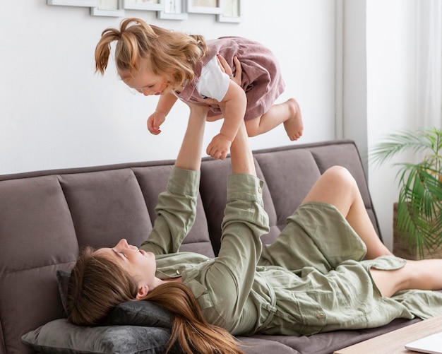 Mother holding up child