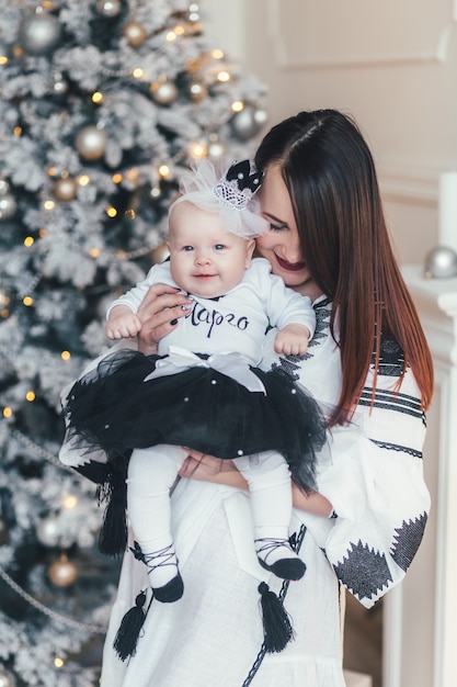 The mother holds on hands her daughter