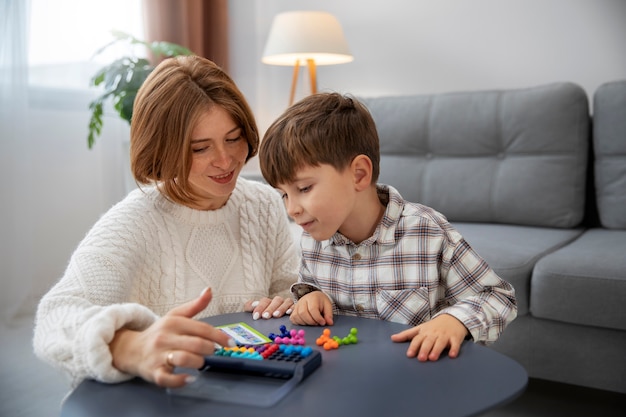 Mother and kid playing medium shot