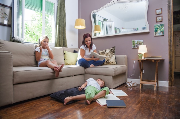 Free photo mother and kids having fun on sofa