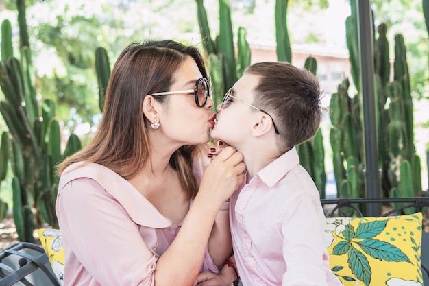 Mother kissing her son