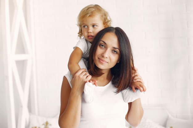 Mother and little daughter having fun at home