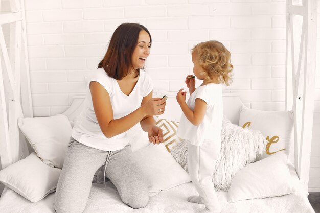 Mother and little daughter having fun at home