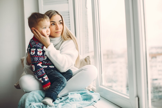 Mother and little son have fun at home