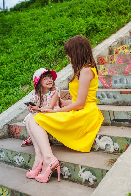 Mother looking at her daughter while she is smiling