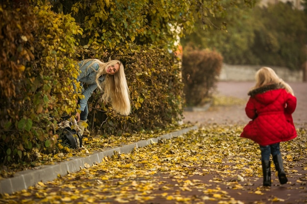 Mother playing hide and seek with her daughter