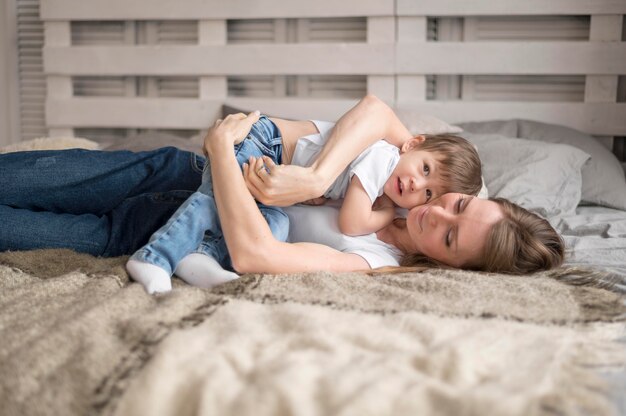 Mother playing hugging son