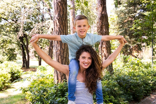 Mother playing in park with her son