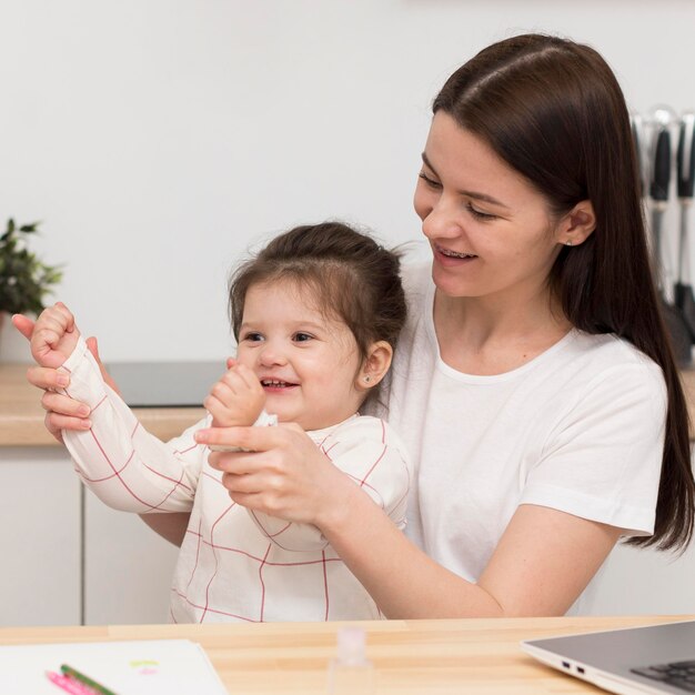 Mother playing with daughter