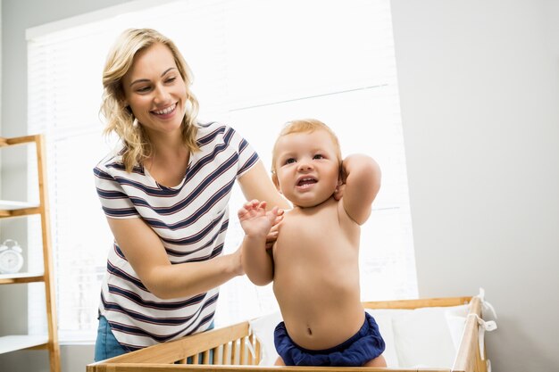 Mother playing with her baby boy