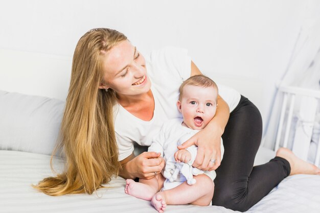 Mother playing with her baby