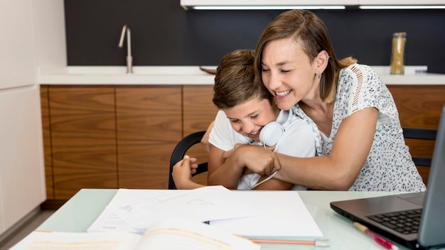 Mother playing with her son at home