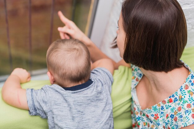 Mother pointing something to her son