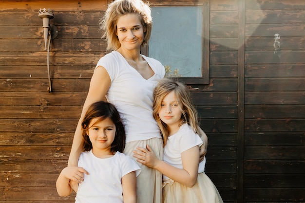 Mother posing with daughters