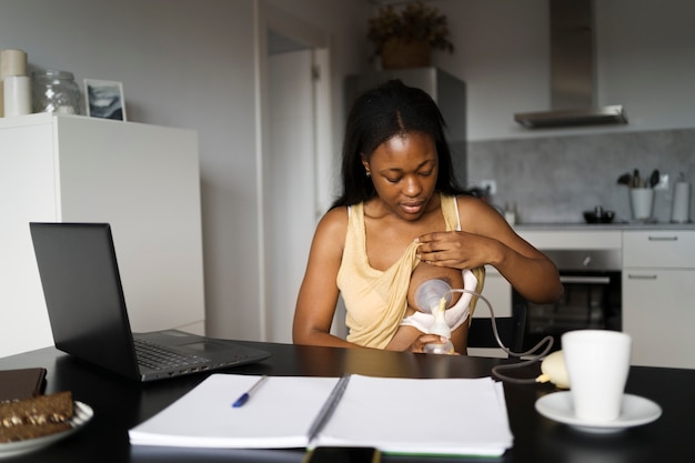 Free photo mother preparing breast milk for child