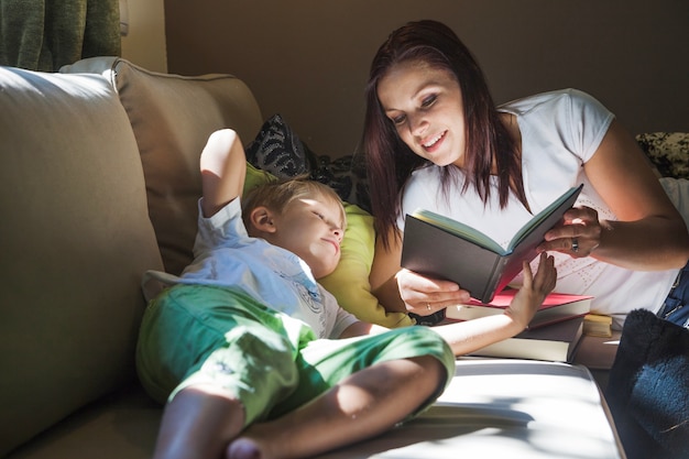 Mother reading book to son