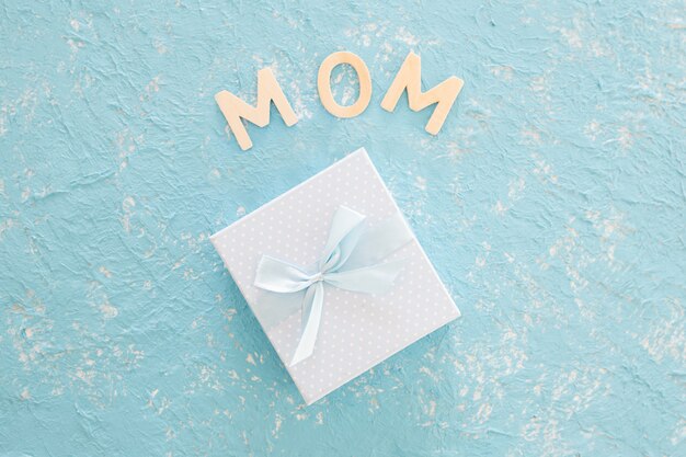 Mother's day gift on blue texture background