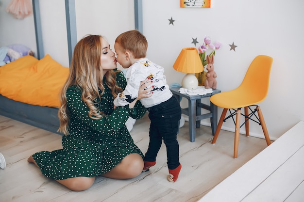 Mother sitting at home with little son