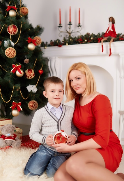 Mother sitting with his son on the floor