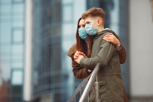 Mother and son are wearing disposable masks