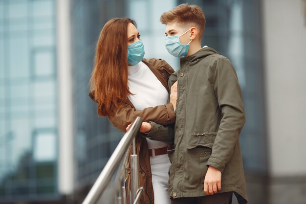 Mother and son are wearing disposable masks