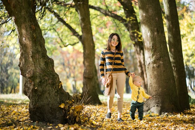 Mother and son in autumn park