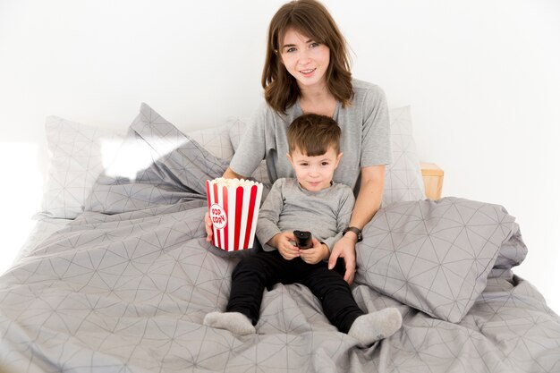 Mother and son eating popcorn