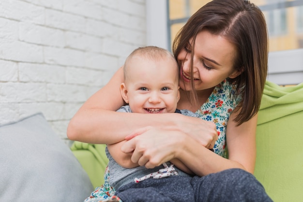 Mother and son laughing while playing