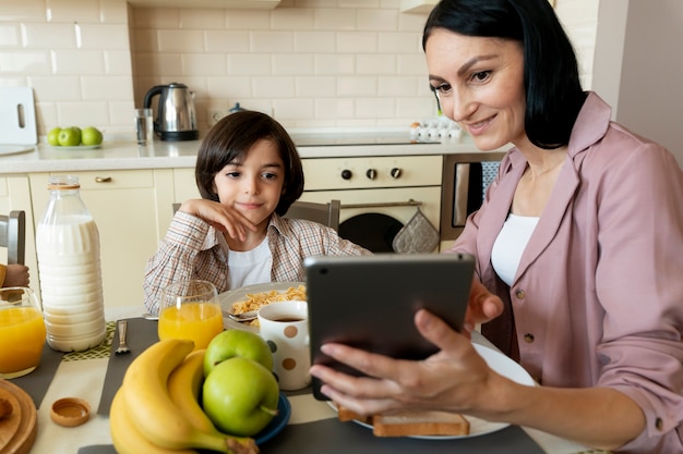 Mother and son looking on a tablet