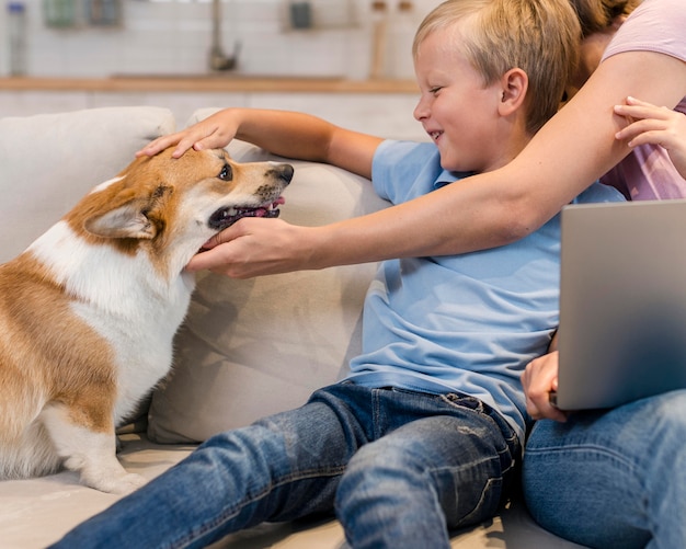 Mother and son petting family dog