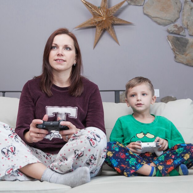 Mother and son playing video games