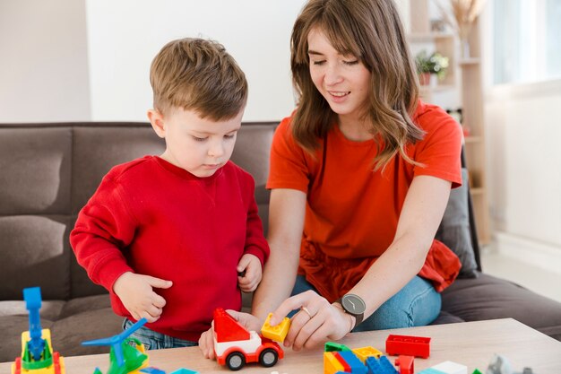 Mother and son playing with toys