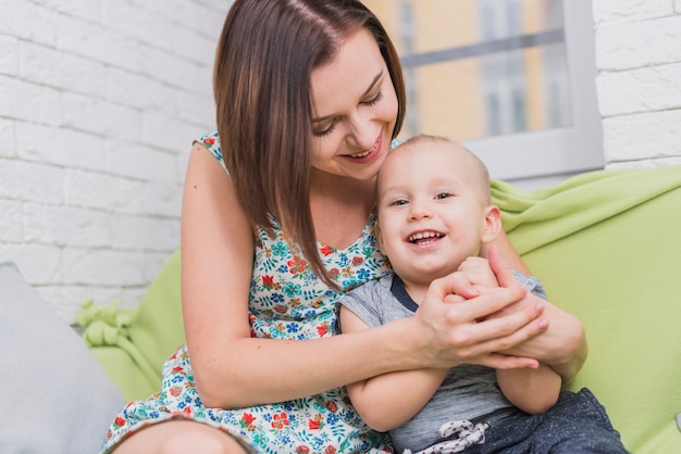 Free photo mother and son posing happily