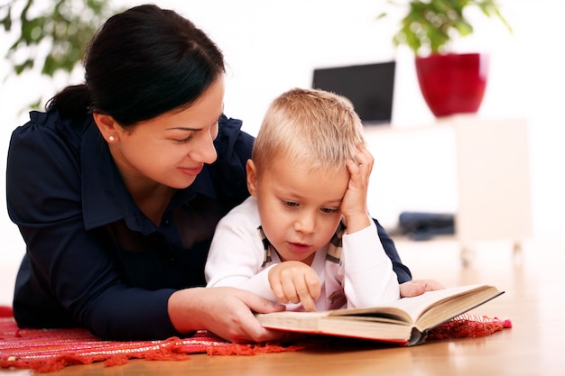 mother and son reading together