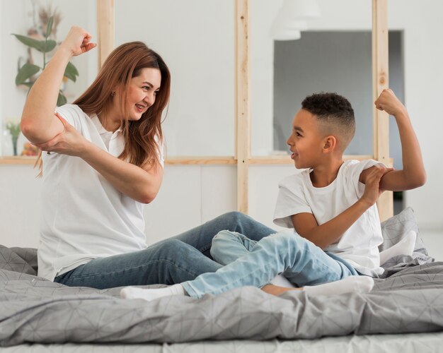 Mother and son showing off their muscles