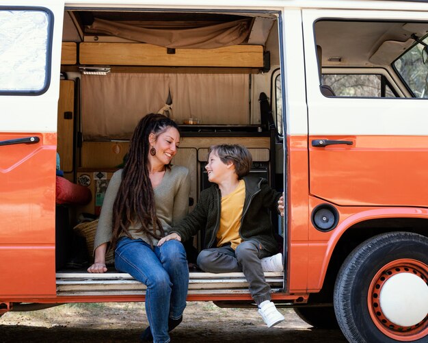 Mother and son sitting in car