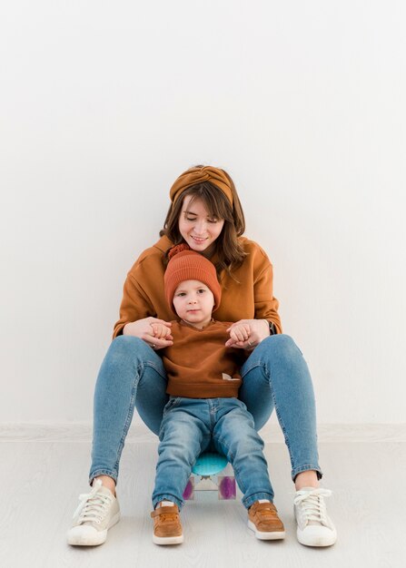 Mother and son on skateboard